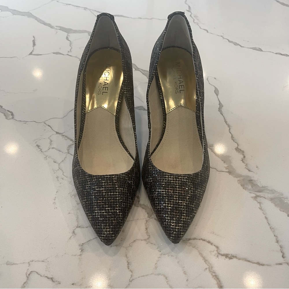 Women’s Michael Kors heels size 7. Black and gold leopard.